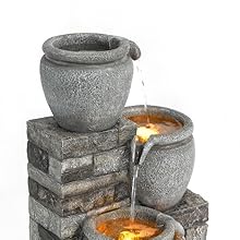 side image of the fountain in the middle of a garden